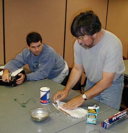 laying salt water soaked paper towel over aluminum foil.