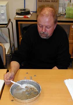 floating aluminum coins on water