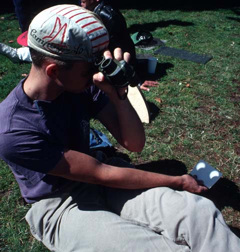 use binoculars to project the eclipse.