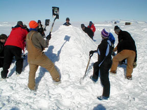 packing a snowmound.