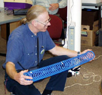 Paul excies resonance on a slinky , a monofilament line runs inside the slinky