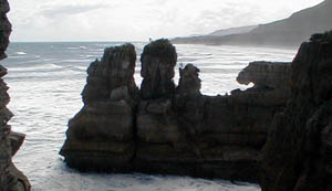 rocks at Punakaiki behind sign.