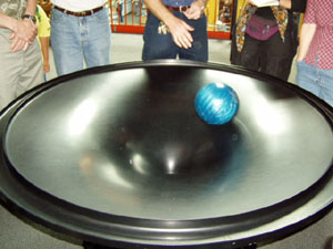A bowling ball in a gravity well