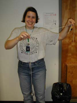 Sarah holds the pendulum