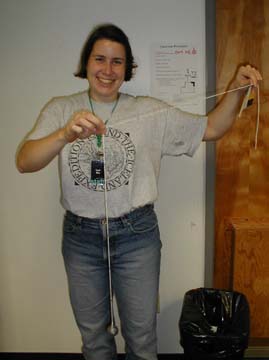 Sarah holds the pendulum