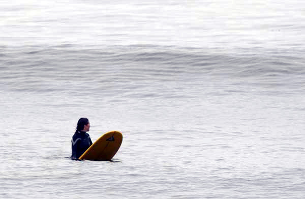 Lori Lambertson waits for a wave