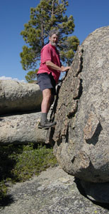 Hal Murray climbs a boulder on Eagle Beaks Ridge