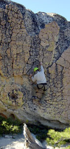 Paul Doherty downclimbs the radial boulder