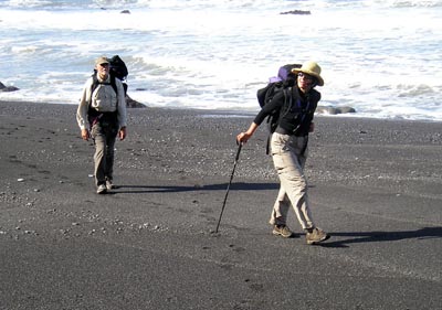 Paul Morgan and Leslie Warren hike the beach