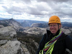 Paul Doherty on Tenaya Peak Yosemite Valley behind