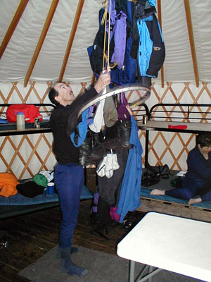 Martin hangs clothes to dry them