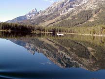 canoeing across Leigh Lake in the morning