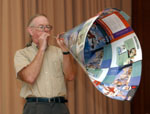 Paul Doherty plays the straw oboe with the giant bell at the NSTA